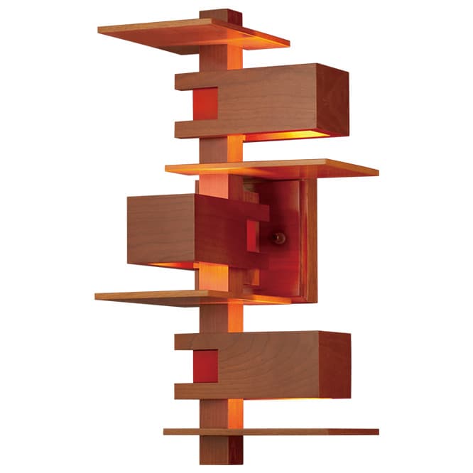 TALIESIN™3 WALL SCONCE
1933年、ヒルサイド・ホーム・スクール体育館を劇場に改装しました際に設計されましたペンダントが原型のモデルにウォールタイプがデビュー。ボックス内の光源が上方に反射しつつも遮光板によりさらなる表情を演出できますの。66,000円（YAMAGIWA東京ショールーム TEL 03 6741 5800）。