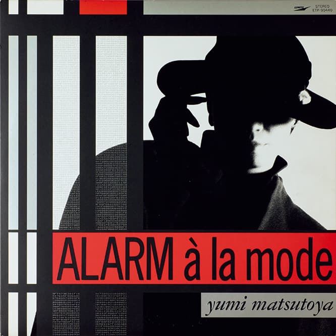 自分のデザインを確立した作品。松任谷由実『ALARM à la mode』（1986年）「"ユーミン、逃走"というテーマを思いついて。（ピエト）モンドリアンのようなラインと、ユーミンを合体させたら鉄格子の中にいるように見えたんです」
