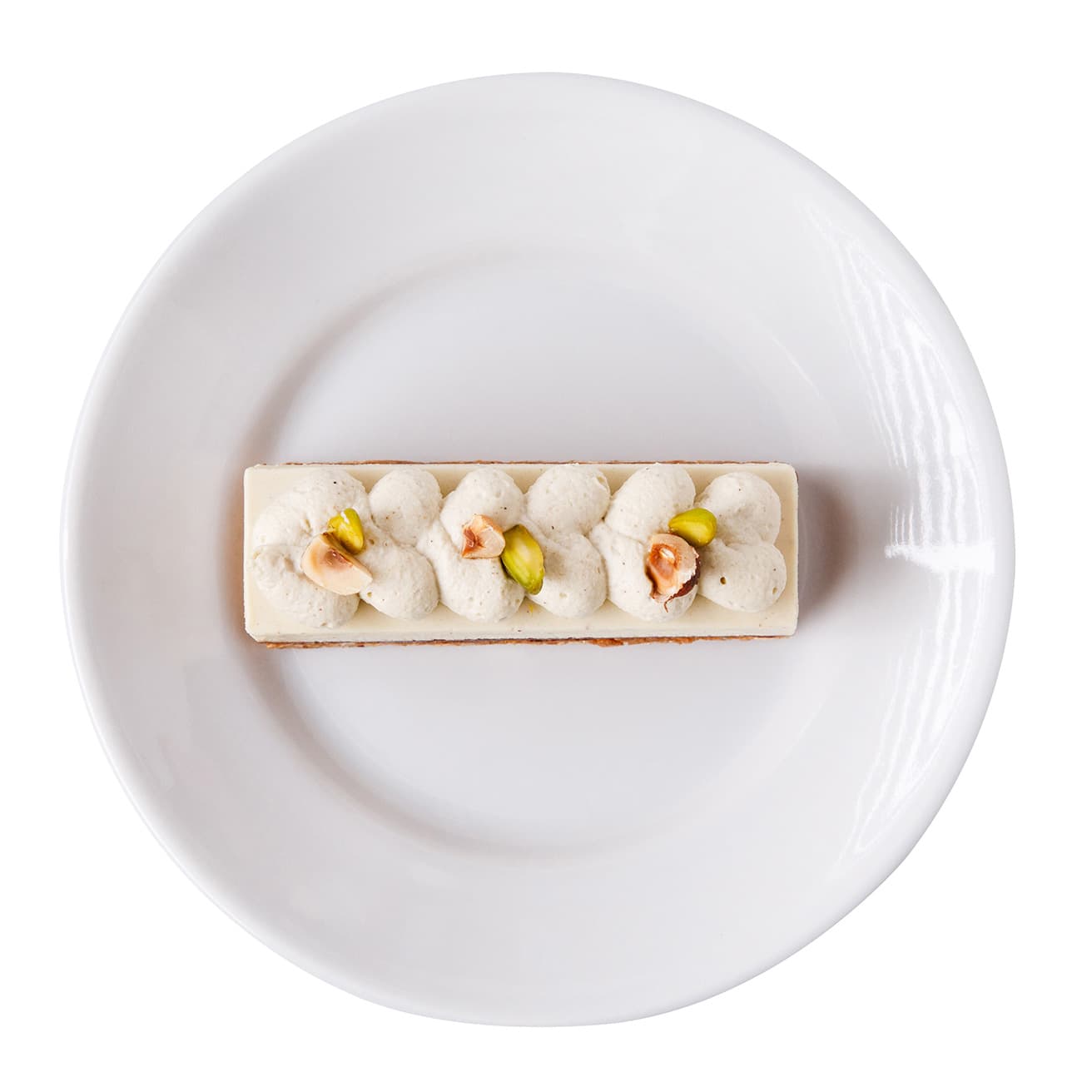 《ジャンドゥーヤ・ピスタチオ》650円。ヘーゼルナッツとピスタチオを贅沢に使い、様々な食感を重ねた磯尾シェフのスペシャリテ。