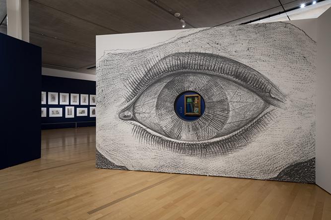 「シュルレアリスムと絵画」展示風景。エルンスト《博物誌》を拡大した穴あきのパネルが出迎える。　photo_Ken Kato