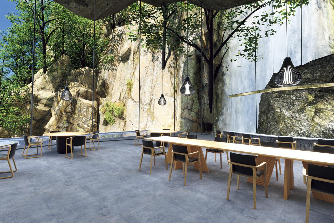 立方体部分の内部にあるレストラン。岩壁と〈カンディハウス〉のインテリアが調和する。