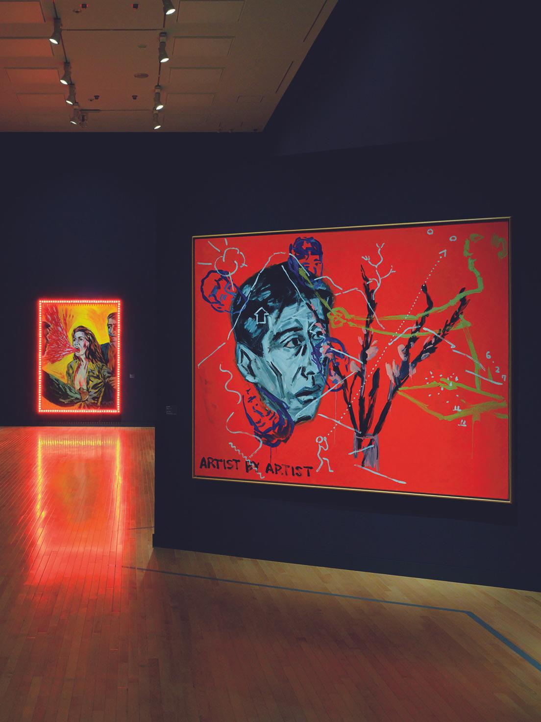 東京での展示は「多元宇宙論」など13のテーマに分けられている。最初の「神話の森へ」の《画家の自画像》（1982年、右）は横尾が画家として本格的に活動を開始した直後の作品。奥は《赤い叫び》（1983年）。